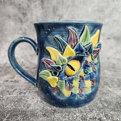 Mardi Gras Dragon Eye Mug. L/H Handle