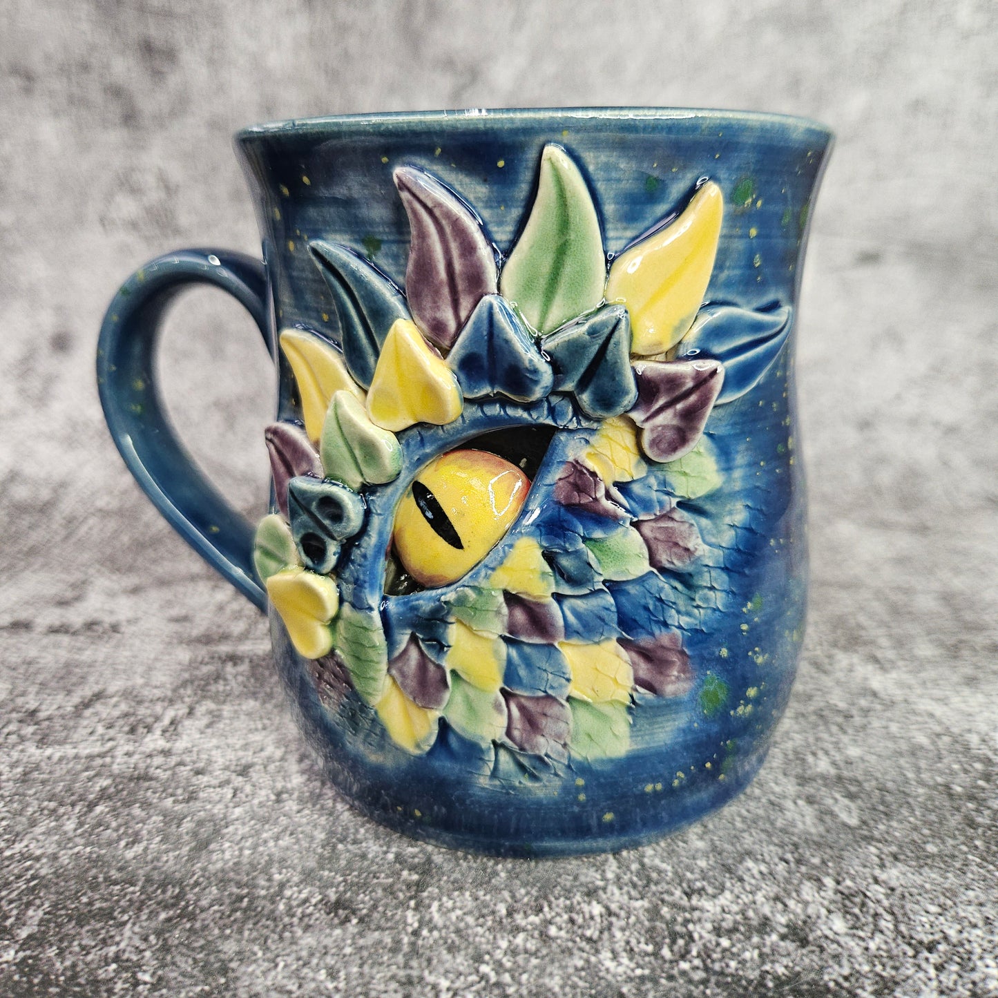 Mardi Gras Dragon Eye Mug. L/H Handle